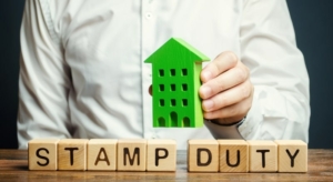 businessman-and-wooden-blocks-with-the-word-stamp