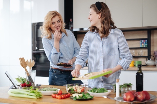mother-and-daughter-teenager-cooking-together